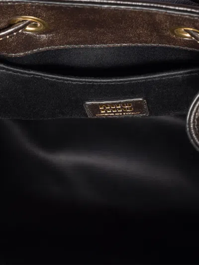 Miu Miu Buckle-fastening Medium Backpack In Brown