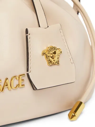 Versace Mini Tag Logo Clutch Bag In Neutral