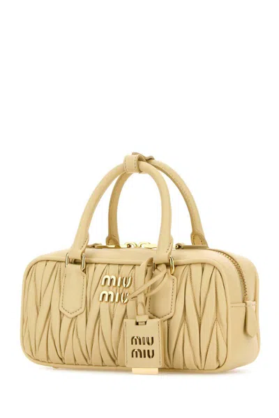Miu Miu Handbags. In Yellow