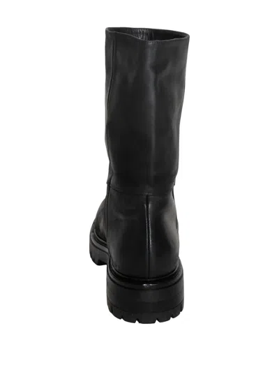 Chuckies Lug-sole Boots In Black