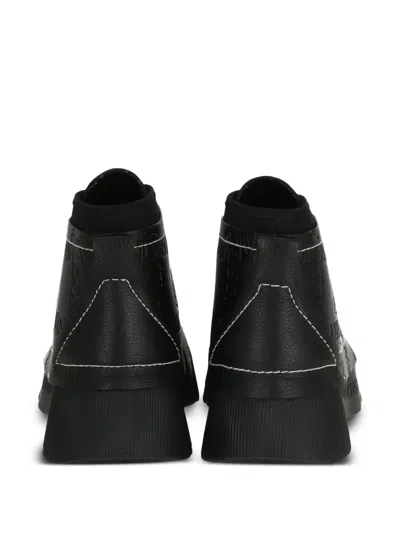 Jw Anderson Debossed-logo Sneakers In Black