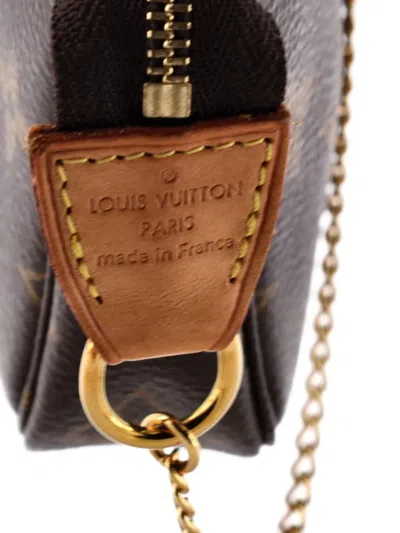 Pre-owned Louis Vuitton Pochette Accessoires Monogram Canvas Mini Clutch Bag In Brown