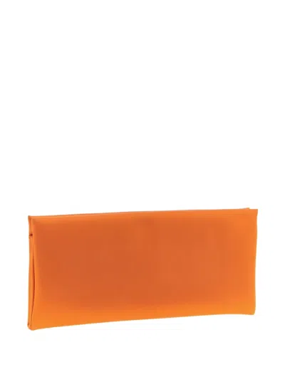 Saint Laurent Medium Cassandre-charm Clutch Bag In Orange