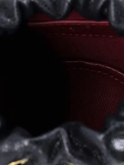 Pre-owned Chanel Twist Your Buttons Drawstring Quilted Caviar Mini Bucket Bag In Black