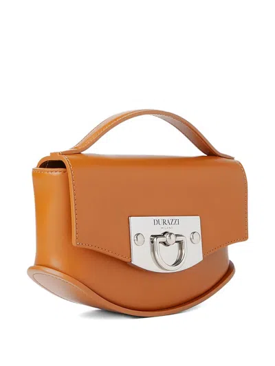 Durazzi Milano Curved Leather Handbag In Brown