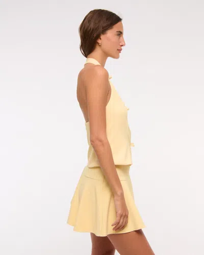 Abercrombie & Fitch High Rise Flirty Drop-waist Mini Skort In Yellow