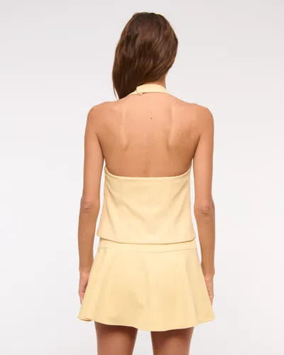 Abercrombie & Fitch High Rise Flirty Drop-waist Mini Skort In Yellow