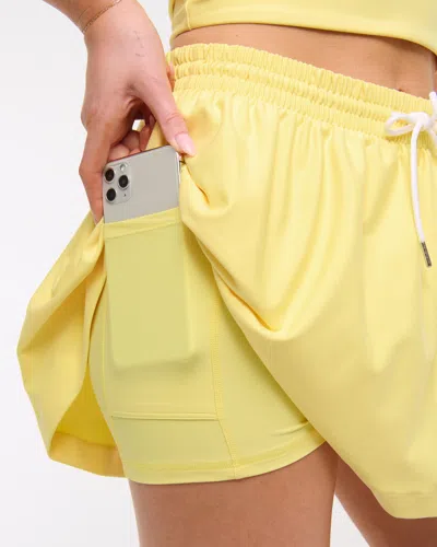 Abercrombie & Fitch Ypb Sculptlux High Rise Flirty Skirt In Yellow