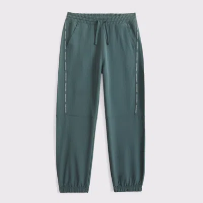 Abercrombie & Fitch Ypb Cozy-lined Logo Tape Sweatpants In Green