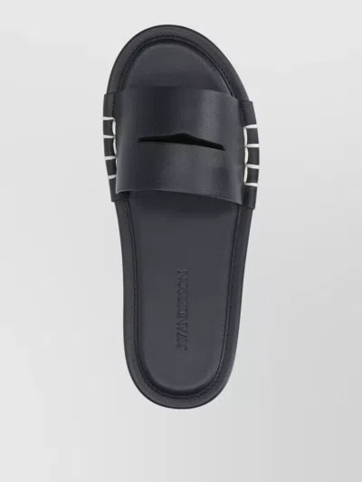 Jw Anderson Mules Flat Sole Open Toe Metal Accents In Black