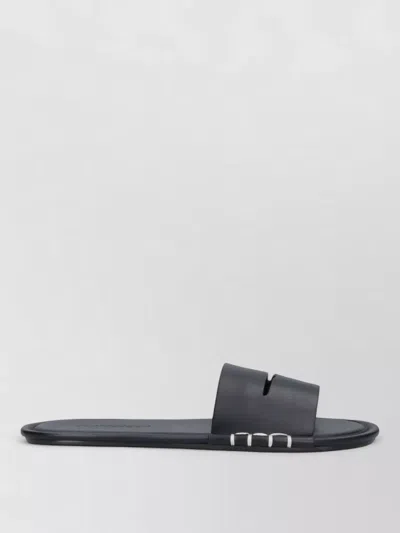 Jw Anderson Mules Flat Sole Open Toe Metal Accents In Black