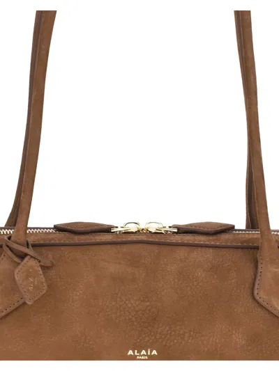 Alaïa Women Le Teckel Shoulder Bag In Brown