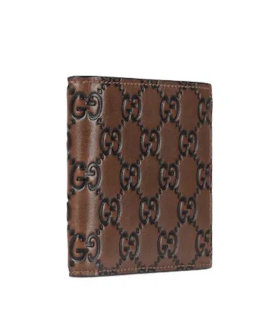 Gucci Men Gg Emblem Leather Wallet With Embossed Gg Logo In Brown