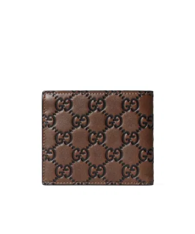 Gucci Men Gg Emblem Leather Wallet With Embossed Gg Logo In Brown