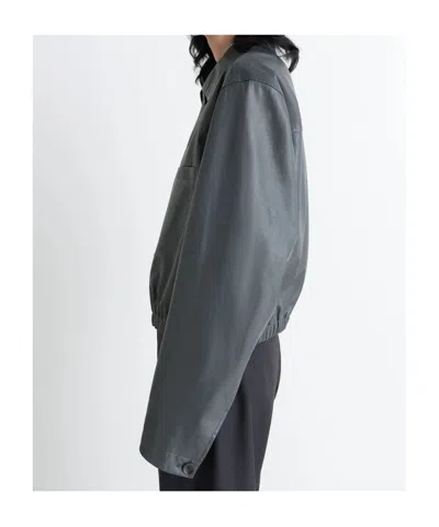 Lemaire Buttoned-up Elasticated Leather Jacket In Gray