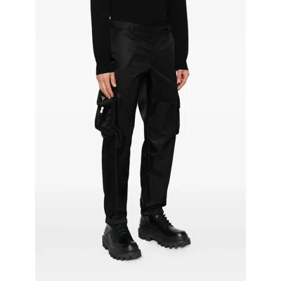 Prada Logo-plaque Trousers In Black