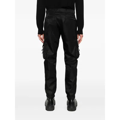 Prada Logo-plaque Trousers In Black