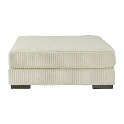 Signature Design By Ashley Lindyn Cushioned Upholstered Ottoman In Sand