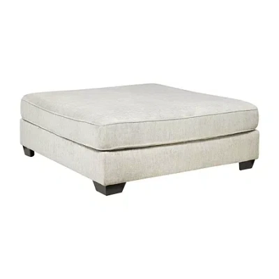 Signature Design By Ashley Raewyn Collection Upholstered Ottoman In Sand