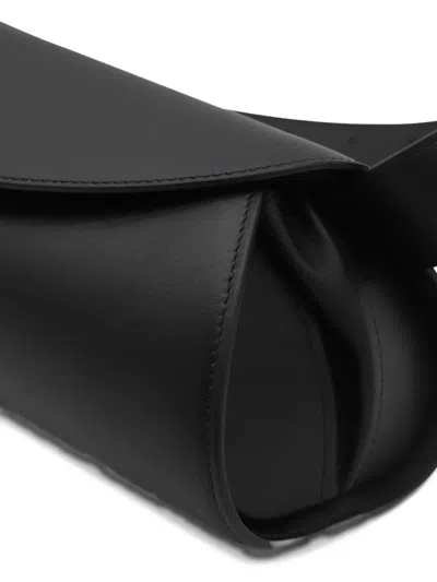 Jil Sander Cannolo Logo Embossed Small Shoulder Bag In Black