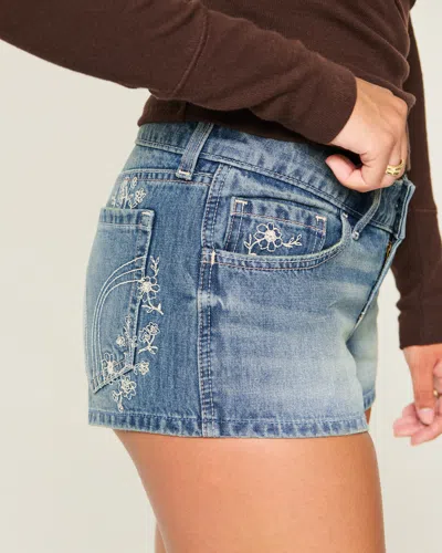 Hollister Ultra Low-rise Medium Wash Floral Embroidered Denim Mini Shorts In Blue