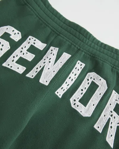 Hollister Senior Graphic Baggy Sweatpants In Green