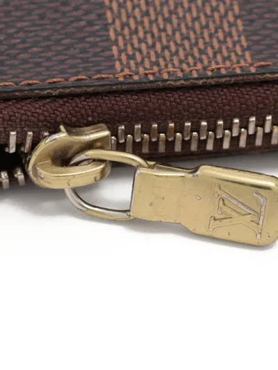 Pre-owned Louis Vuitton 2009 Damier-pattern Coin Wallet In Brown