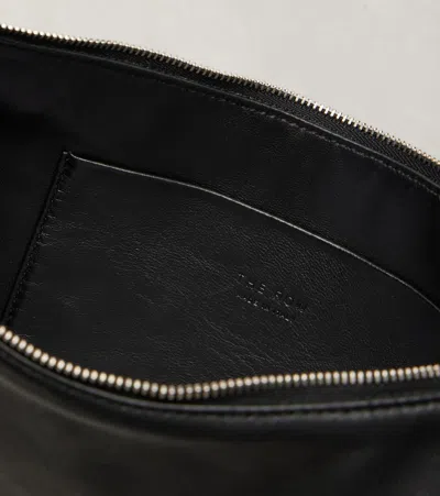 The Row Izzy Small Crescent Shoulder Bag In Leather In Black
