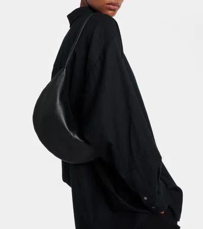 The Row Izzy Small Crescent Shoulder Bag In Leather In Black