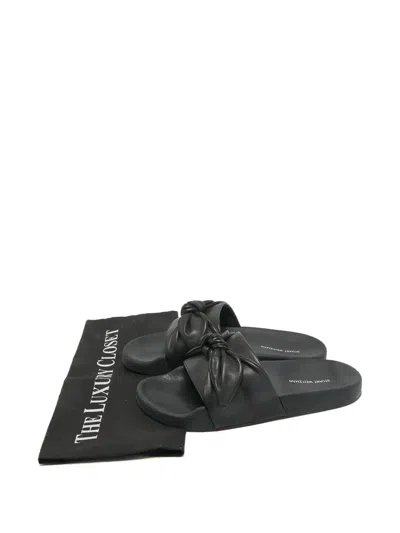 Pre-owned Stuart Weitzman Bow Leather Slides In Black