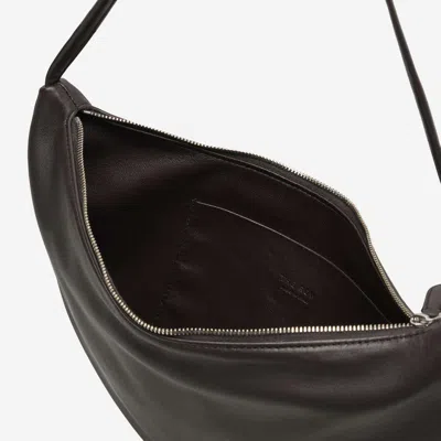 The Row Izzy Small Crescent Shoulder Bag In Leather In Brown