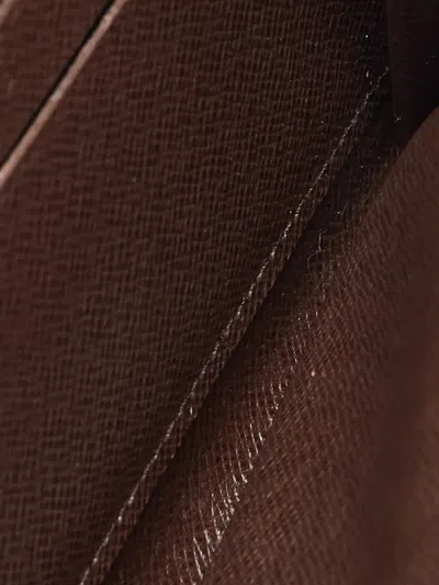 Pre-owned Louis Vuitton 2011 Damier Ebene Wallet In Brown