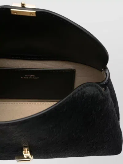 Totême Mini Clutch Bag Curved Silhouette In Black