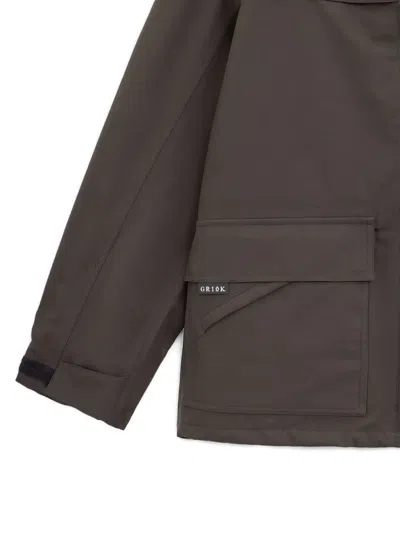 Gr10k Zipped Flap-pocket Jacket In Brown