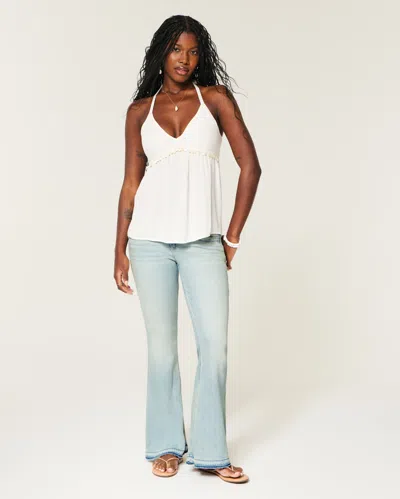 Hollister Ultra Low-rise Light Wash Let-down Hem Flare Jeans In Blue