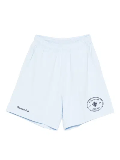 Sporty And Rich X Hotel Du Cap Eden Roc Eden Crest Embroidered Mini Shorts In Blue