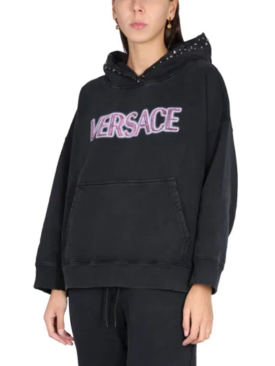 Versace Stud-embellished Logo Cotton Hoodie In Black