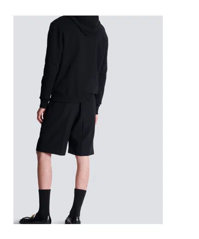 Balmain Logo Printed Drawstring Hoodie In Black