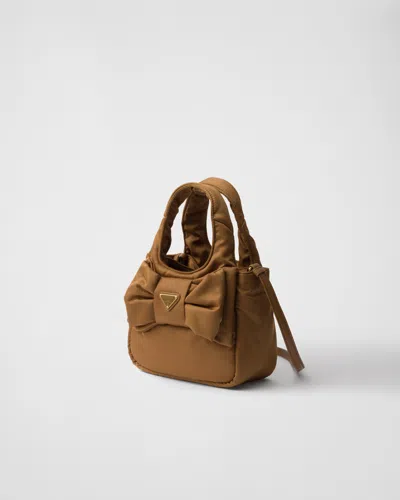 Prada Padded Re-nylon Mini-bag With Bow In Brown