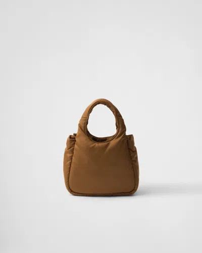 Prada Padded Re-nylon Mini-bag With Bow In Brown
