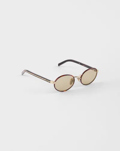 Prada Sunglasses With The Iconic Metal Plaque In Gold