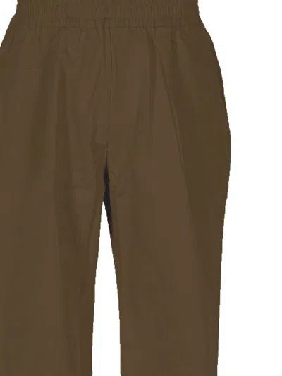 Family First Trousers In Brown