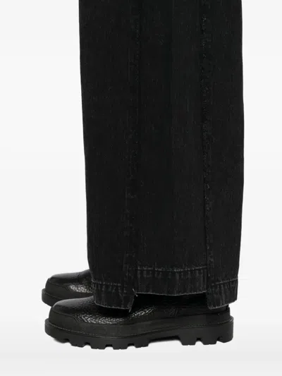 Songzio Asymmetric Cut Flare Jeans In Black