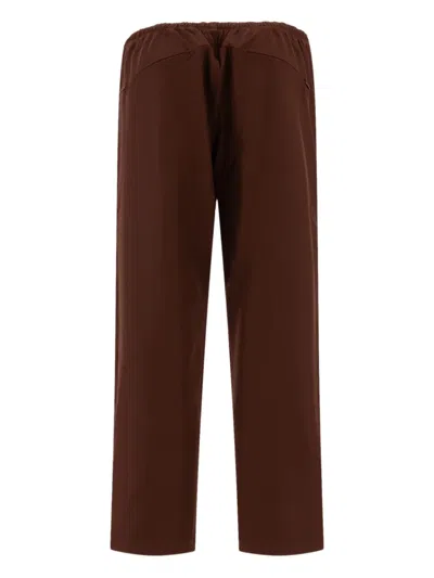 Needles Logo Embroidered Mid Rise Trousers In Brown