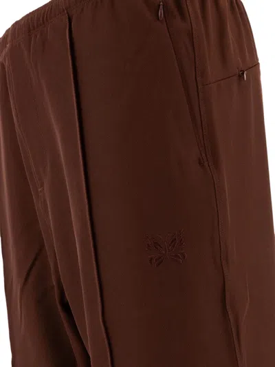 Needles Logo Embroidered Mid Rise Trousers In Brown