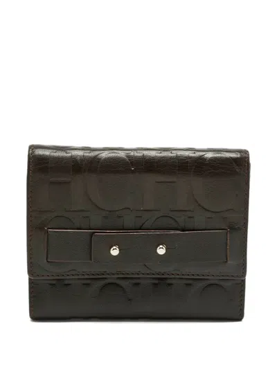 Pre-owned Carolina Herrera Vintage Monogram-embossed Leather Wallet In Brown
