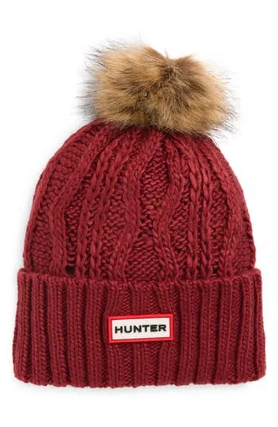 Hunter Logo Cable Knit Faux Fur Pompom Fleece Lined Beanie In Red