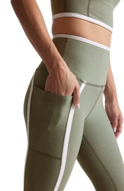 Beyond Yoga Out Of Pocket Side Stripe High Waist Pocket Leggings In Green
