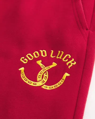 Hollister Good Luck Graphic Bootcut Sweatpants In Red