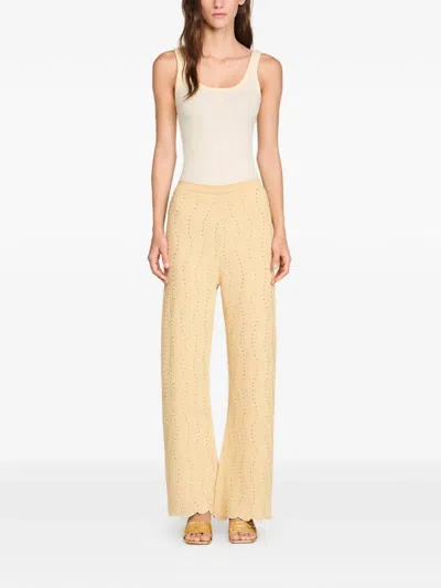 Sandro Geometric-pattern Textured Trousers In Neutral